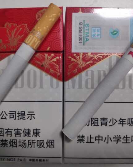 Marlboro Red cigarette packaging, two cigarettes laid across the front and rear packs