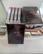 Liqun Sunshine Zun Mid cigarette packaging, packs and cartons stacked on a glass counter