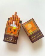 Guiyan Guojiuxiang Slim cigarette packaging, opened amber and brown pack filled with cigarettes