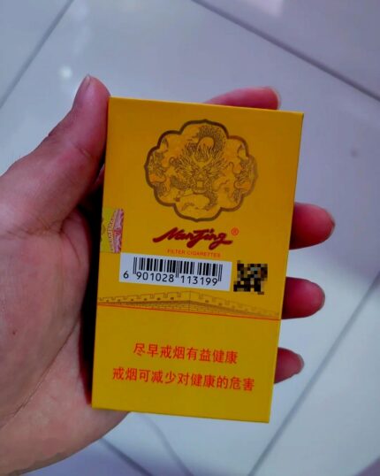 Nanjing 95 Slim cigarette packaging, rear of the yellow pack held in one hand