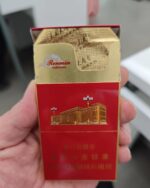Great Hall Red Slim cigarette packaging, opened red pack held to show the foil lining