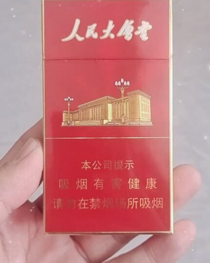 Great Hall Red Slim cigarette packaging, close-up of the red pack front held in one hand
