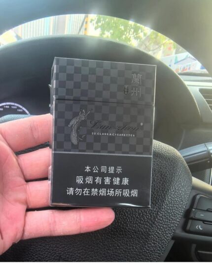 Lanzhou Black Mid-Slim cigarette packaging, black checkered pack held inside a car