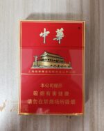 Chunghwa Double Mid-Slim cigarette packaging, front of the red pack photographed flat on wood